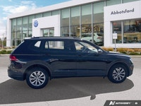 Navigate every journey with confidence and ease in the striking Black 2018 Volkswagen Tiguan Trendli... (image 2)