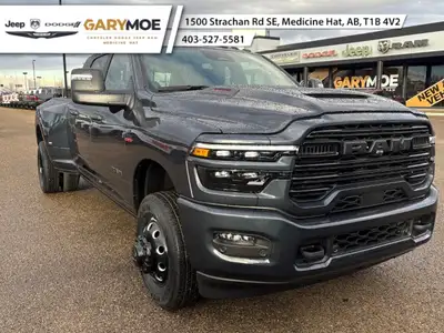 Experience the power and finesse of the 2026 Ram 3500 Laramie 4x4 Mega Cab, cloaked in a bold blue t...