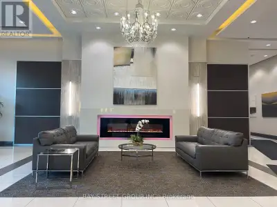 Move Into This Luxury Condo At World on Yonge, featuring a gorgeous and spacious 2-split bedroom + D...