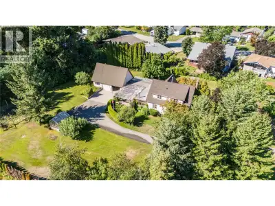Nestled at the end of a meandering driveway in the heart of Castlegar, this enchanting character hom...