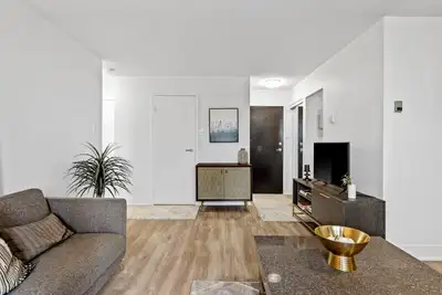Fully renovated spacious suite features kitchen with modern features and finishes including laminate...