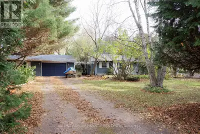 Situated On A Large 2-Acre Private Mature Treed Lot Across The Road From Lake Simcoe, This Home Is L...