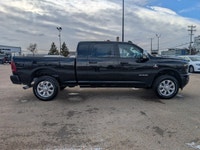 The 2026 Ram 2500 Laramie Mega Cab in Diamond Black Crystal Pearl combines heavy-duty capability wit... (image 7)