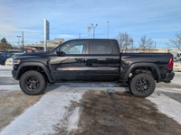 The 2026 Ram 1500 RHO Crew Cab in Diamond Black Crystal Pearl delivers bold styling and high-perform... (image 2)
