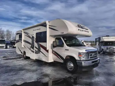 Thor Motor Coach Four Winds Class C gas motorhome 28Z highlights: Walk-Around Queen Bed Mid-Coach En...