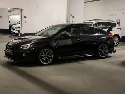 Experience the thrill of the 2015 Subaru WRX 4dr Sdn STI Man w/Sport-tech Pkg, beautifully designed...