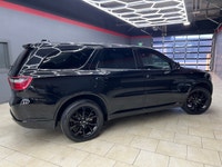 Experience the bold presence and versatility of the 2019 Dodge Durango GT in striking black with an... (image 5)