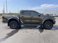 The 2024 Ford Ranger Raptor, finished in Shelter Green with refined Ebony leather-trimmed seats, is... (image 9)