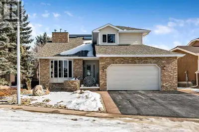Set on a premium ridge lot backing onto the Sheep River Valley, pathway system, and nature reserve,...