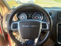 A spacious family minivan with comfortable seating, convenient features, and versatile cargo space,... (image 9)