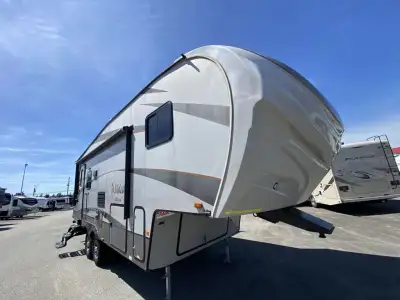 The Wildcat Maxx 242RLX half ton fifth wheel by Forest River offers double slide outs and a u-shaped...