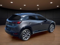 Get ready to conquer the roads with the 2022 Mazda CX-3 GT, a sophisticated gray SUV that combines a... (image 5)