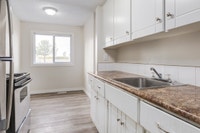 Amenities: In-suite Laundry • Private Yard • Spacious Rooms Suite & Building: Spacious two-bedroom,... (image 7)