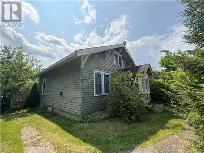 Cottage in the City Country Charm, City Location This solid, character-rich home sits on over half a...
