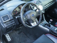 Feel the thrill of the road with the 2017 Subaru WRX STI Sport, finished in a striking shade of gray... (image 9)