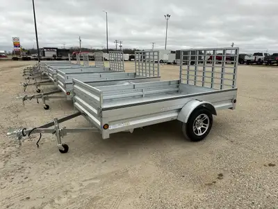 This Stirling 6' x 10' utility trailer with a 36" landscape rear gate features an extendable front a...