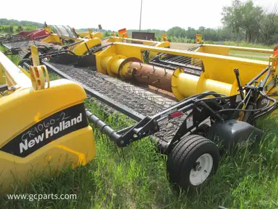 2009 76C New Holland 9 belt header with 16ft swathmaster off a CR9070 NH combine. It has a hydraulic...