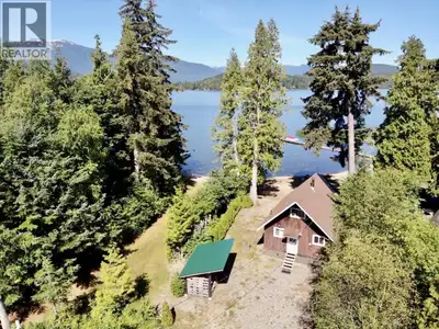 Tucked into the highly sought-after First Avenue stretch of Lakelse Lake, this rare freehold lakefro...