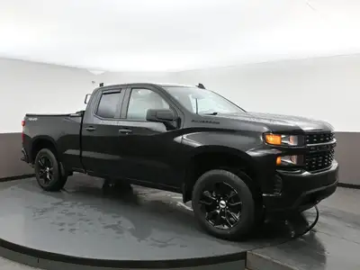 The Custom trim adds 20" black painted aluminum wheels, body-color bumpers and grille bar, and deep-...