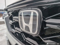 The 2024 Honda CR-V Hybrid Touring is a pre-owned compact SUV that emphasizes refined comfort, effic... (image 9)