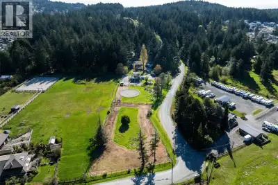 Peacefully set on 2 acres just minutes from downtown Langford, this exceptional Horse & Hobby farm o...