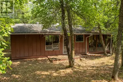 Cabin in the woods with a dock on Lake of the Woods? Check. Nearly 5 acres with great seclusion and...