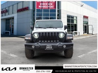 The 2022 Jeep Wrangler Unlimited Willys 4x4 in a classic white exterior and rugged 44 drivetrain is... (image 1)