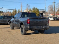 The 2026 Ram 1500 Rebel Crew Cab in Granite Crystal Metallic makes a bold statement with its rugged... (image 3)