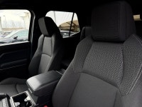 The SR5 focuses on utility and versatility, offering a standard three-row configuration and a part-t... (image 5)