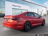 The 2019 Volkswagen Jetta Highline, presented in eye-catching Habanero Orange Metallic with a sophis... (image 4)