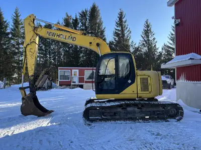 New Holland EH130 with 24 inch tooth bucket, manual thumb, 94 hp Isuzu engine, 13 ton, max digging d...