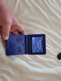 Gameboy Advance SP with Pokemon Emerald, Leaf Green and Mario