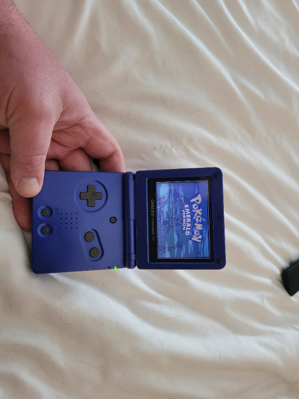 Gameboy Advance SP with Pokemon Leaf Green and Mario in Older Generation in Cape Breton