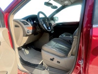 A spacious family minivan with comfortable seating, convenient features, and versatile cargo space,... (image 8)