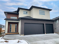 5 Bedroom evergeen home with triple attached garage