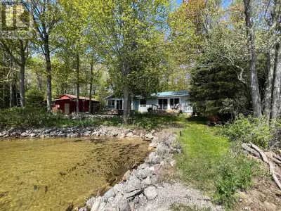 Nestled along the tranquil shores of Miller Lake, this inviting 3-bedroom, 1-bathroom cottage offers...
