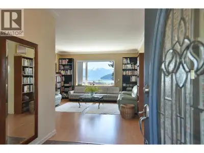 Situated on an 18,000 square ft subdividable lot, this 3,700 square ft home with legal suite offers...