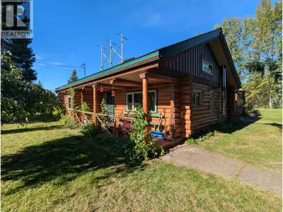 Nicely renovated log home with a carriage house on 1.16 riverfront acres in the Village of Telkwa. T...