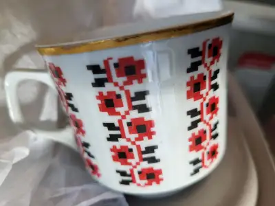 NEW UKRAINIAN TEA CUP AND SAUCER SET $15.00//UKRAINIAN VINYL RECORD $10.00