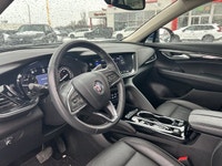 The 2023 Buick Envision Essence, presented in a sophisticated Gray finish, masterfully blends luxuri... (image 5)
