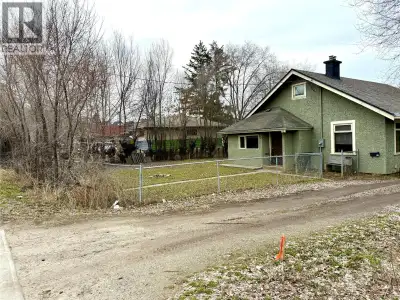 (Holding property with redevelopment potential). This 0.29-acre rectangular lot—measuring 74.88 feet...