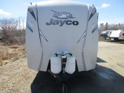 A great family two slide trailer with a front queen bedroom , rear side double bunks , table w/ 4 ch...