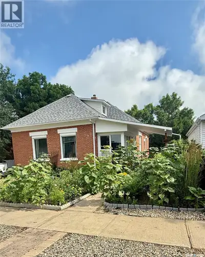 Welcome to this charming brick home that offers far more space than it appears from the outside! Thi...
