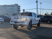 The 2026 Ram 2500 Laramie Crew Cab Night Edition in Bright White combines aggressive style, heavy-du... (image 6)