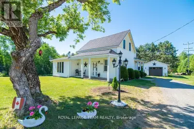 Set back from the road on approximately 1.5 acres, this three-bedroom home offers a large lawn, matu...