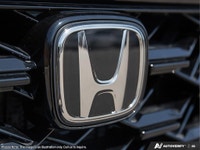 Explore the elegance and capability of the 2026 Honda CR-V Hybrid Touring AWD, draped in a sophistic... (image 8)