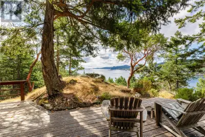 Sandy beach, extraordinary views, and park-like trails, is what this 2.18 acre waterfront property i...