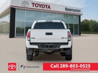 The 2019 Toyota Tacoma TRD Off Road 4x4 Double Cab V6 in a stunning white color with a robust 4x4 dr... (image 6)