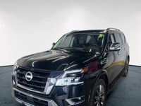 Experience luxury and power in the 2024 Nissan Armada 4x4 Platinum, presented in an eye-catching Bla... (image 1)