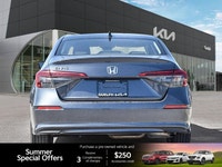 The 2022 Honda Civic Sedan EX, a striking grey 4-door car with a comfortable black interior, redefin... (image 4)